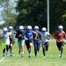  Lincoln football players run a lap around the field during practice at the school on Wednesday, August 14, 2013. Melanie Maxwell | AnnArbor.com